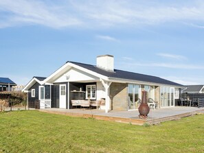 Enjoy a home away from home with a covered patio and comfortable outdoor seating.