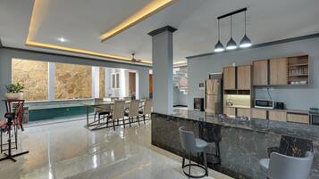 Villa, Patio, Pool View | Private kitchen | Dining tables