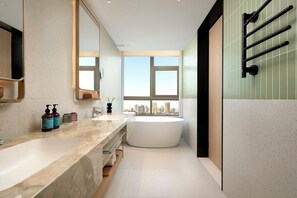 A modern bathroom with a large bathtub, a double sink vanity, and a large mirror. - Atwell Suites Hefei City Center By IHG (Hefei)