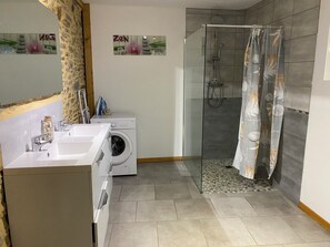 Shower, hair dryer, towels, toilet paper