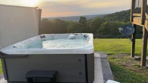 A hot tub in an outdoor setting with a view of the landscape. - Ozark Escape - Hot Tub, Mountain Views, Near River (Compton)