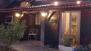 A restaurant named 'Restaurant Du Lac' with a signboard, outdoor seating, and a menu board. - Bungalow 15 in Villereal Rives Southwest France (Rives)