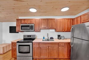 Fridge, coffee/tea maker, cookware/dishes/utensils