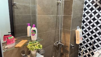 Shower, slippers, towels, soap