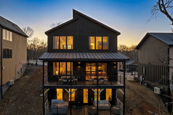 Enjoy a relaxing stay in this charming two-story home with a spacious balcony featuring outdoor seating.