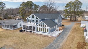 A two-story house with a large deck and a covered porch. - Grays Inn Creek Waterfront Pvt Dock Kayaks & View (Rock Hall)