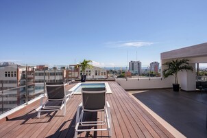 Outdoor pool, open 8:00 AM to 11:00 PM, pool umbrellas, pool loungers