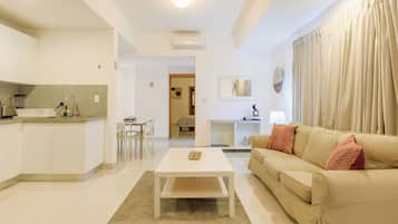 Comfort Apartment, 1 King Bed with Sofa bed, Balcony, City View | Living area | 50-inch Smart TV with cable channels