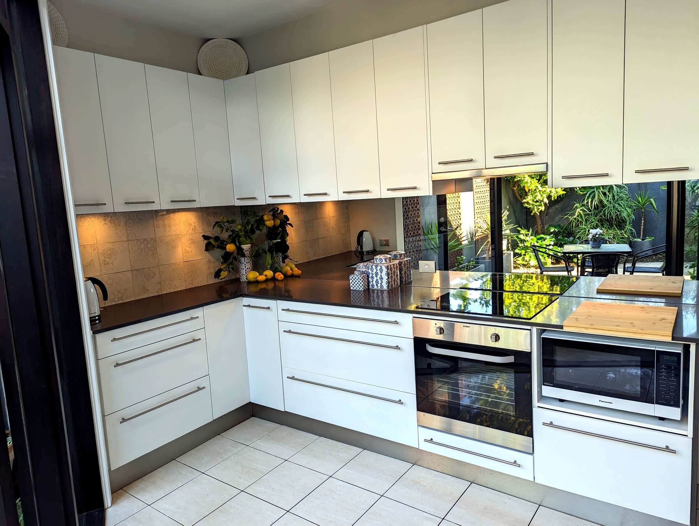 Coffee/tea maker, fridge, microwave, oven