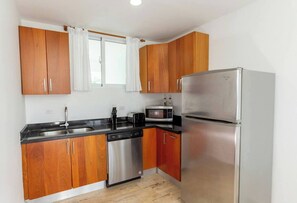 Fridge, microwave, stovetop, cookware/dishes/utensils