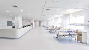 A hospital room with a reception desk, beds, and medical equipment. - Hotel Noble Inn (Ahmedabad)