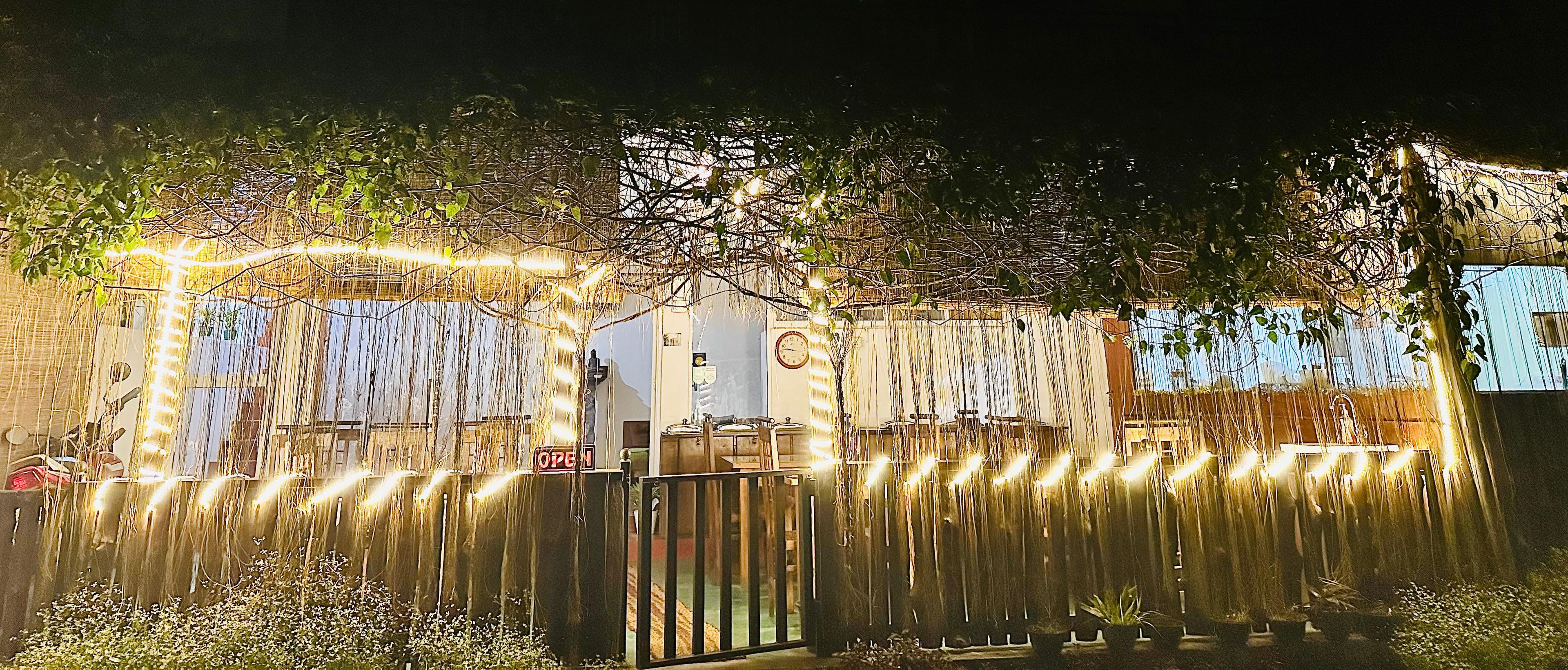 A gated entrance with a sign indicating the property is open.