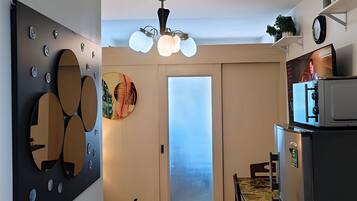 Family Condo, City View | Living area | 42-inch Smart TV with cable channels