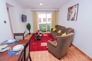 Family Apartment, Balcony, Garden View | Living area