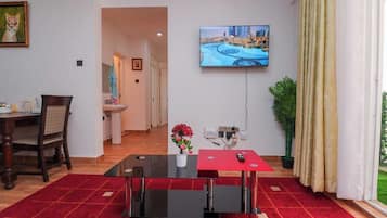 Family Apartment, Balcony, Garden View | In-room dining