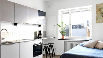 Apartamento básico, vistas a la ciudad | 1 dormitorio, tabla de planchar con plancha, wifi gratis