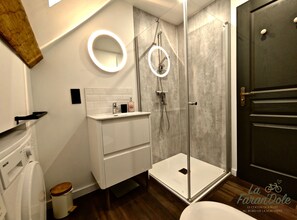 Shower, hair dryer, towels, toilet paper