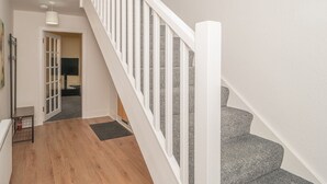 A staircase with white railings leading to a landing. - Charming Family House in Rosewell - Pass the Keys (Edinburgh)