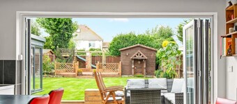 Chalet style home with large garden and beach hut within 2 minute walk