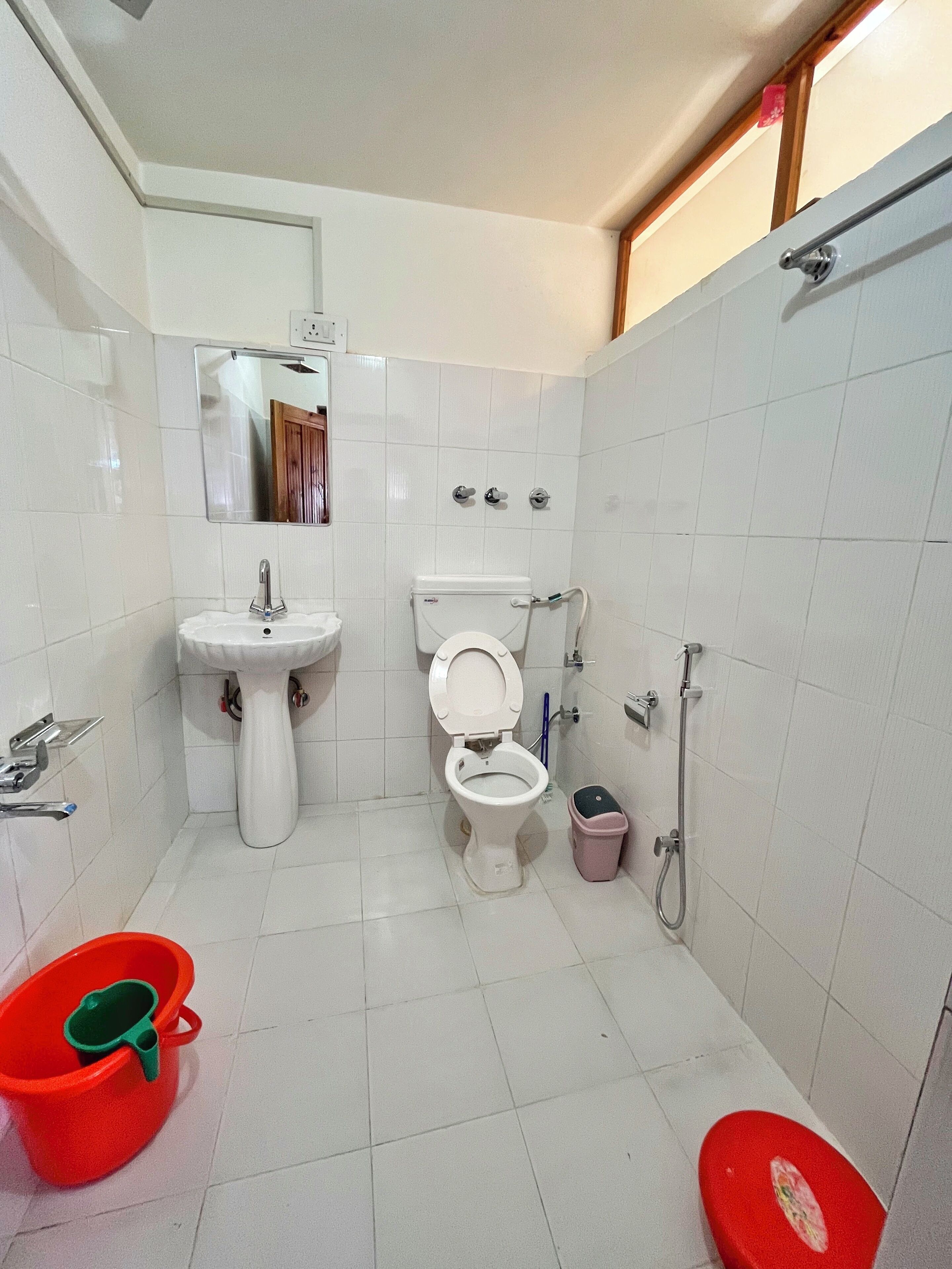 Shower, rainfall showerhead, slippers, towels
