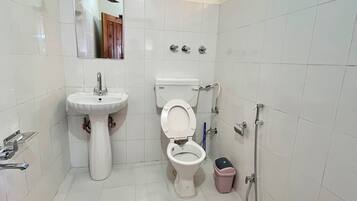 Shower, rainfall showerhead, slippers, towels