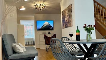 Deluxe Duplex, City View | Living area | 46-inch flat-screen TV with cable channels, TV