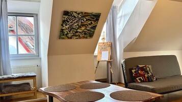 Desk, laptop workspace, blackout drapes, iron/ironing board
