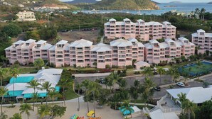 A large hotel with multiple buildings, a swimming pool, and a tennis court. - Studio Double @ WorldMark Elysian Beach Resort (St Thomas)
