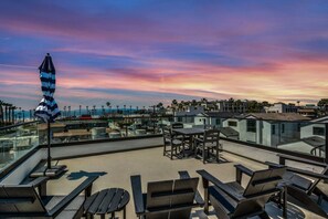 Outdoor dining - Beach Views | Rooftop Nights | HB Living (Huntington Beach)