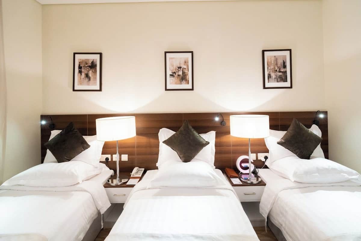 Chambre Triple Deluxe | 1 chambre, Wi-Fi gratuit