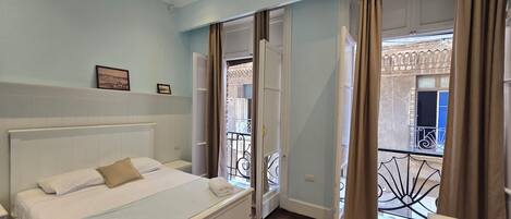 Desk, laptop workspace, free WiFi, bed sheets