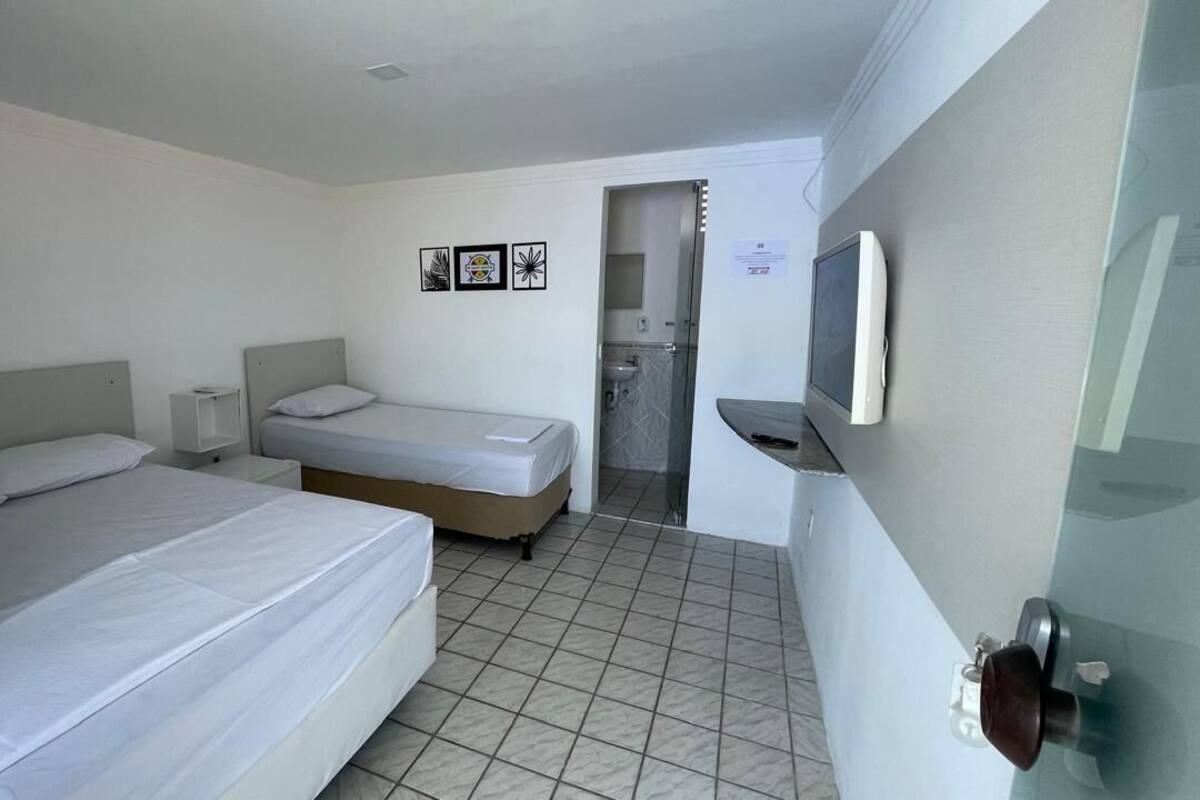 Comfort Triple Room, Private Bathroom, Beachfront | Laptop workspace, blackout curtains, iron/ironing board, free WiFi