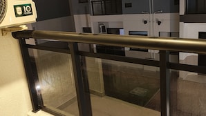 A modern building with multiple windows and balconies. - Summer dream. Beach House: The Perfect Place to Relax and Enjoy! (Recreio dos Bandeirantes Rio de Janeiro)