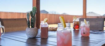 Abilene's Ultimate Backyard Getaway: Putt-Putt, Fire Pits, & Giant Games Galore!