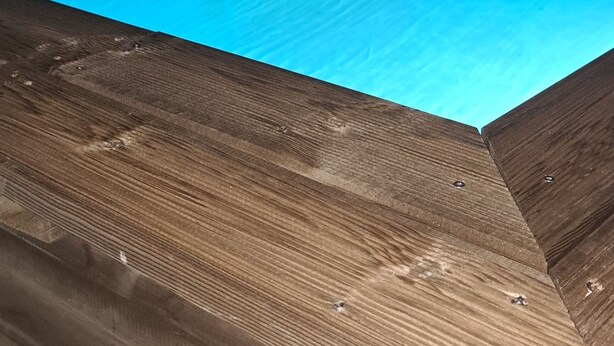 A swimming pool at night with a wooden deck. - Villa tempÔ In a quiet, secure residence. Close to the beach and port (Sainte-Rose)