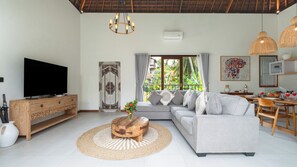 Villa, Pool View | Living room | 32-inch Smart TV with satellite channels - Elephant Villa 5 by Villa Finder (Ubud)