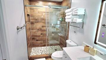 Shower, hair dryer, towels, soap