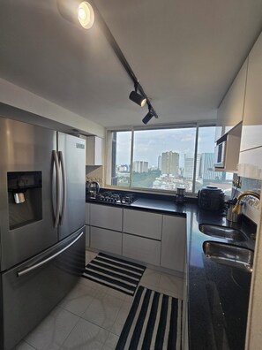 Fridge, microwave, stovetop, coffee/tea maker