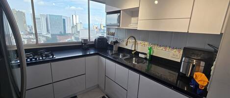 Fridge, microwave, stovetop, coffee/tea maker