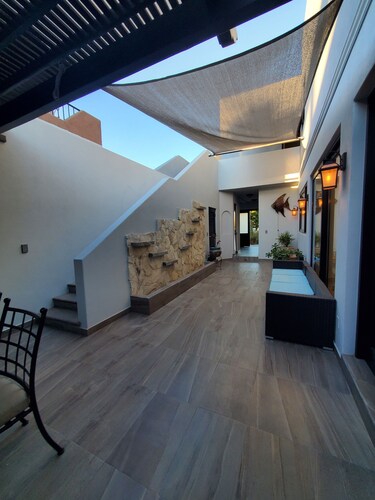 Pristine 3-bed, 3.5-bath villa with mountain, golf course, sea views & hot tub 
