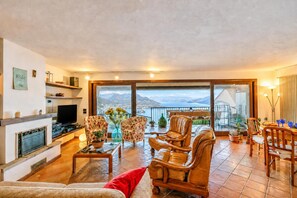 Family Apartment, 1 Bedroom, Terrace, Mountainside (Isola Bella: Lake Maggiore view) | Living area | Flat-screen TV - Isola Bella: Lake Maggiore View Terrace in Stresa (Stresa)
