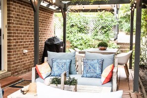 Relax outdoors with a barbecue grill and comfortable seating area.