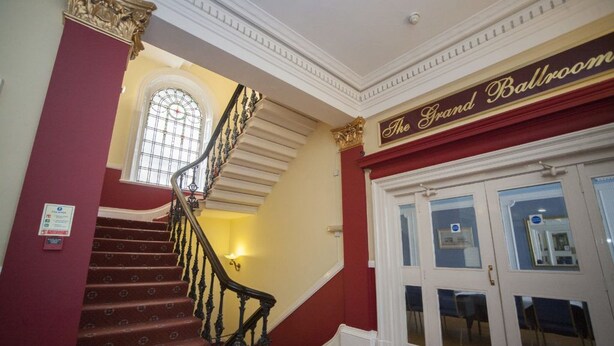 A grand staircase leading to a ballroom with a sign above it. - The White Swan Hotel (Halifax)