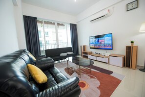 Living area - Comfortable 3-bedroom condo with WiFi, AC in wonderful Sandakan Nature City (Sandakan)