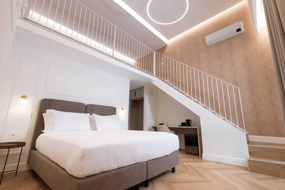 Comfort Quadruple Room | Minibar, desk, laptop workspace, blackout curtains