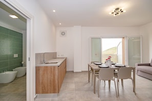 Comfort Quadruple Room, Balcony, Valley View | Living area