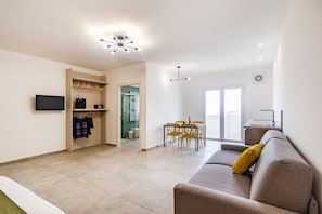 Exclusive Quadruple Room, Balcony, Valley View | Living area | TV - coste ponente (Ragusa)