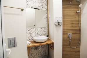 Comfort Studio, Balcony, City View | Bathroom | Shower, hair dryer, slippers, towels