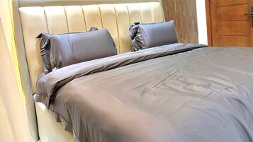 2 bedrooms, blackout curtains, soundproofing, iron/ironing board