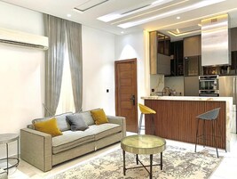 Luxury Apartment, 2 Bedrooms, Kitchen, Executive Level | Living area | Flat-screen TV, printers